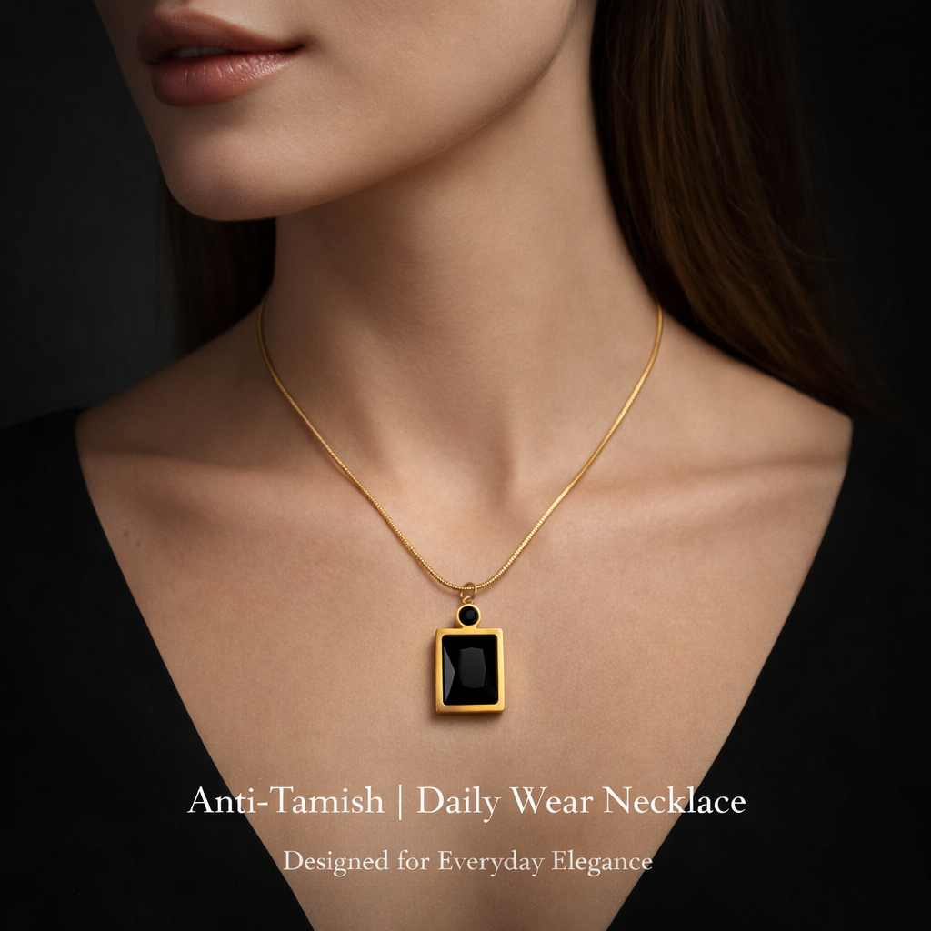 Lifestyle image of minimal black stone necklace styled for everyday wear