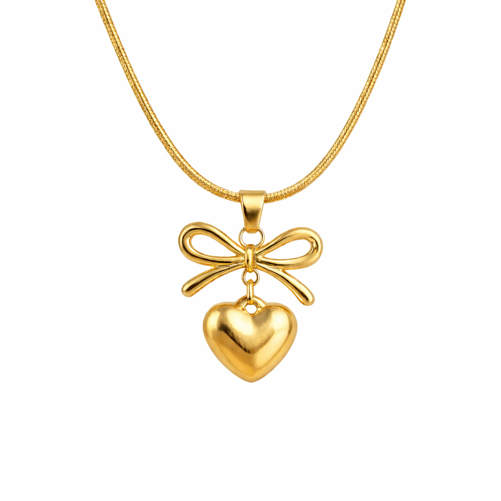 flat lay image of bow and heart pendant necklace for women 