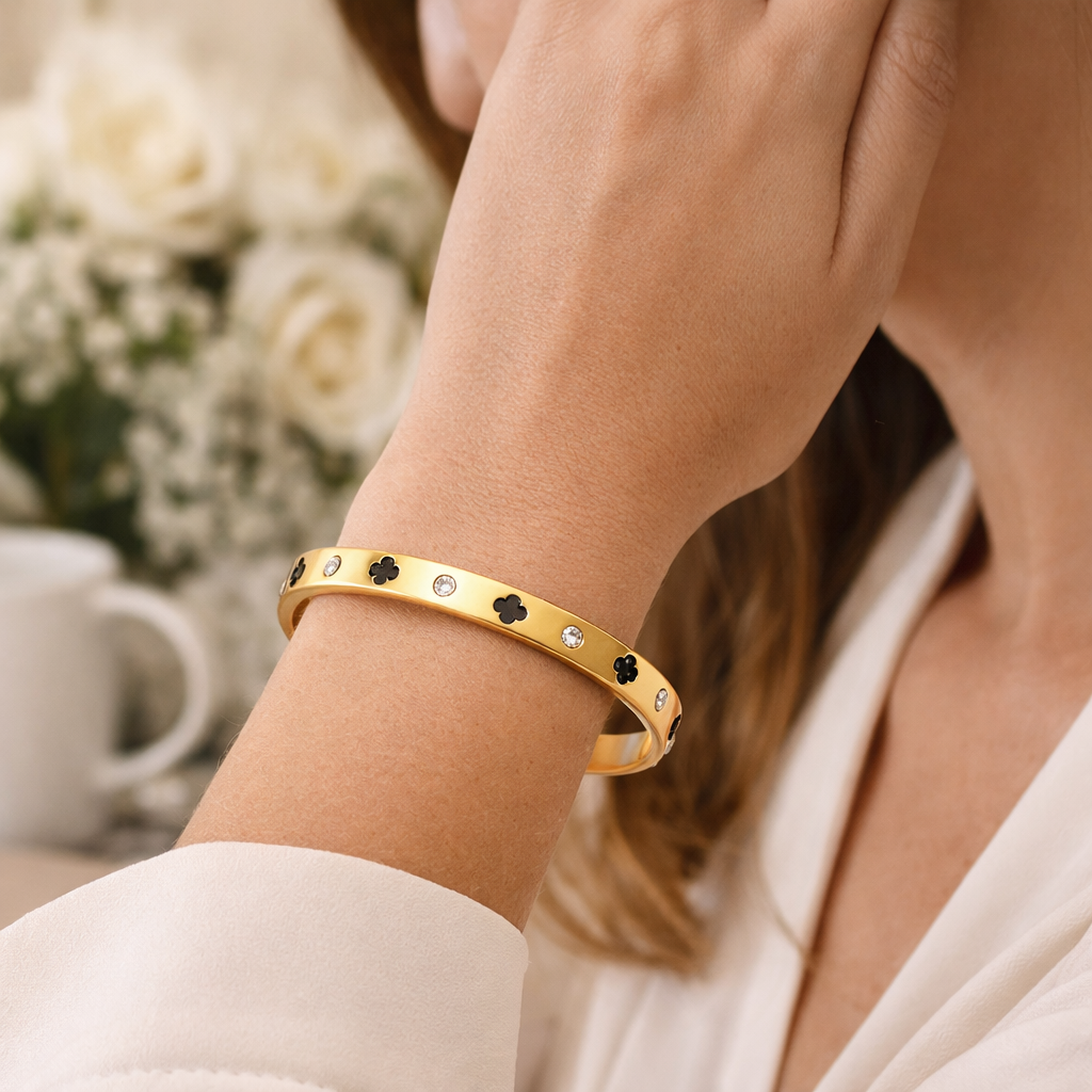 Stylish wrist look featuring a gold clover bangle paired with everyday outfits