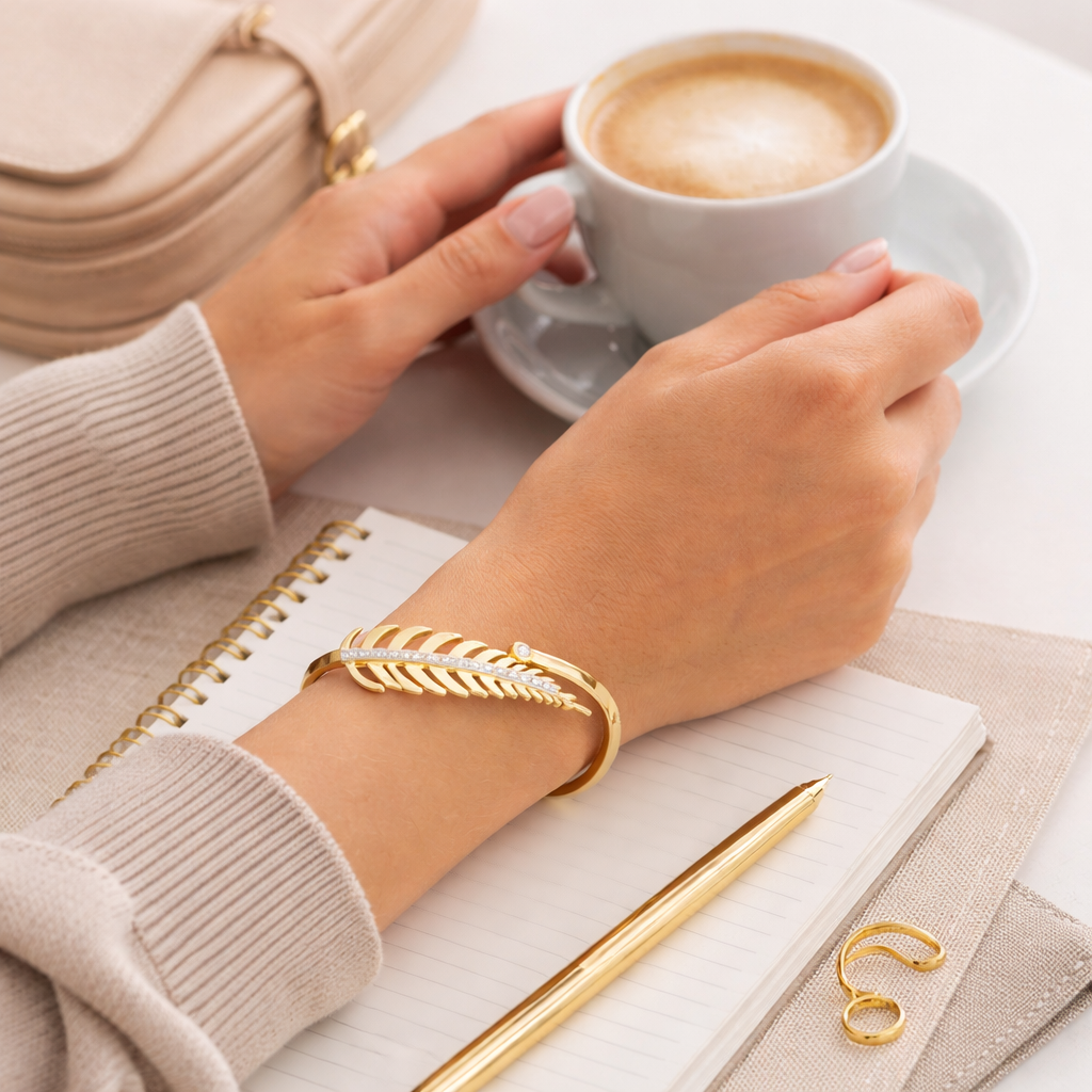 Lifestyle image of leaf-design bracelet styled for everyday wear