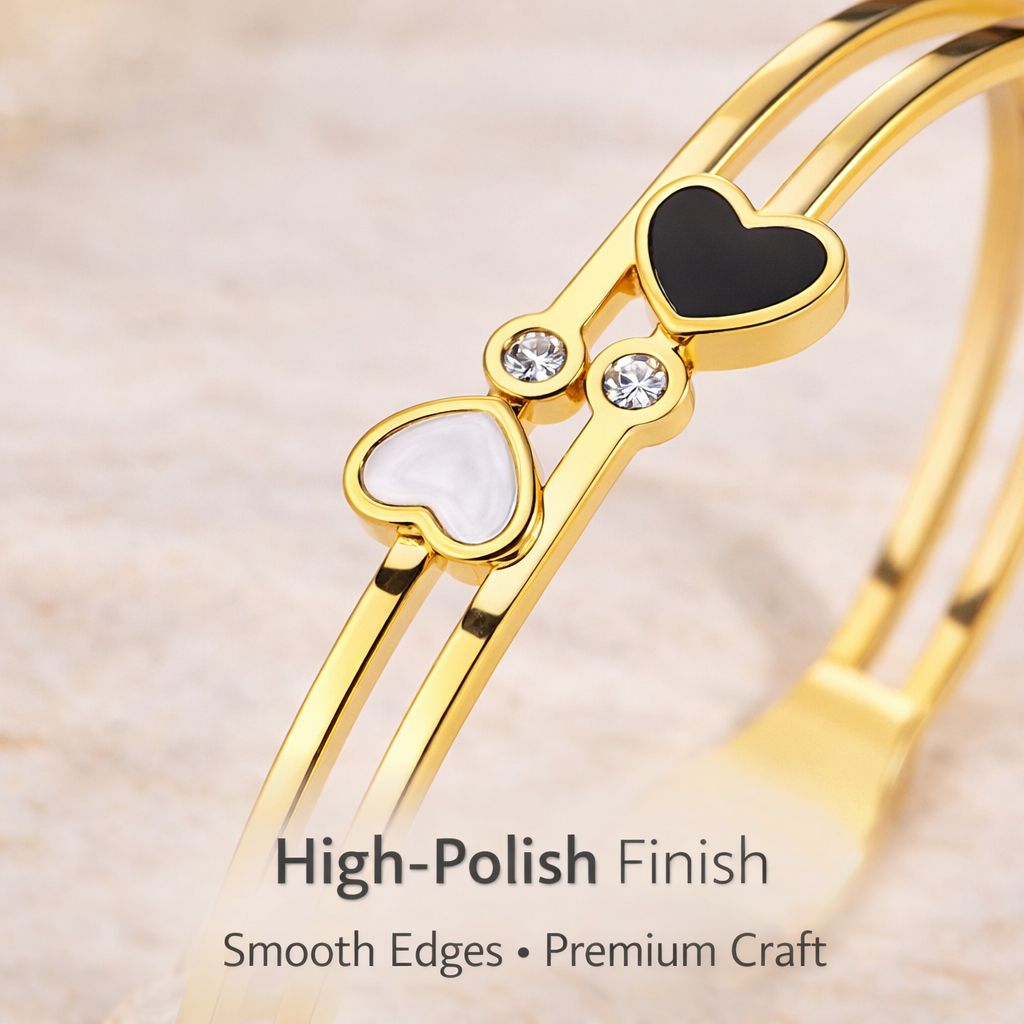 Close-up of dual heart bracelet showing stone detailing and polished finish