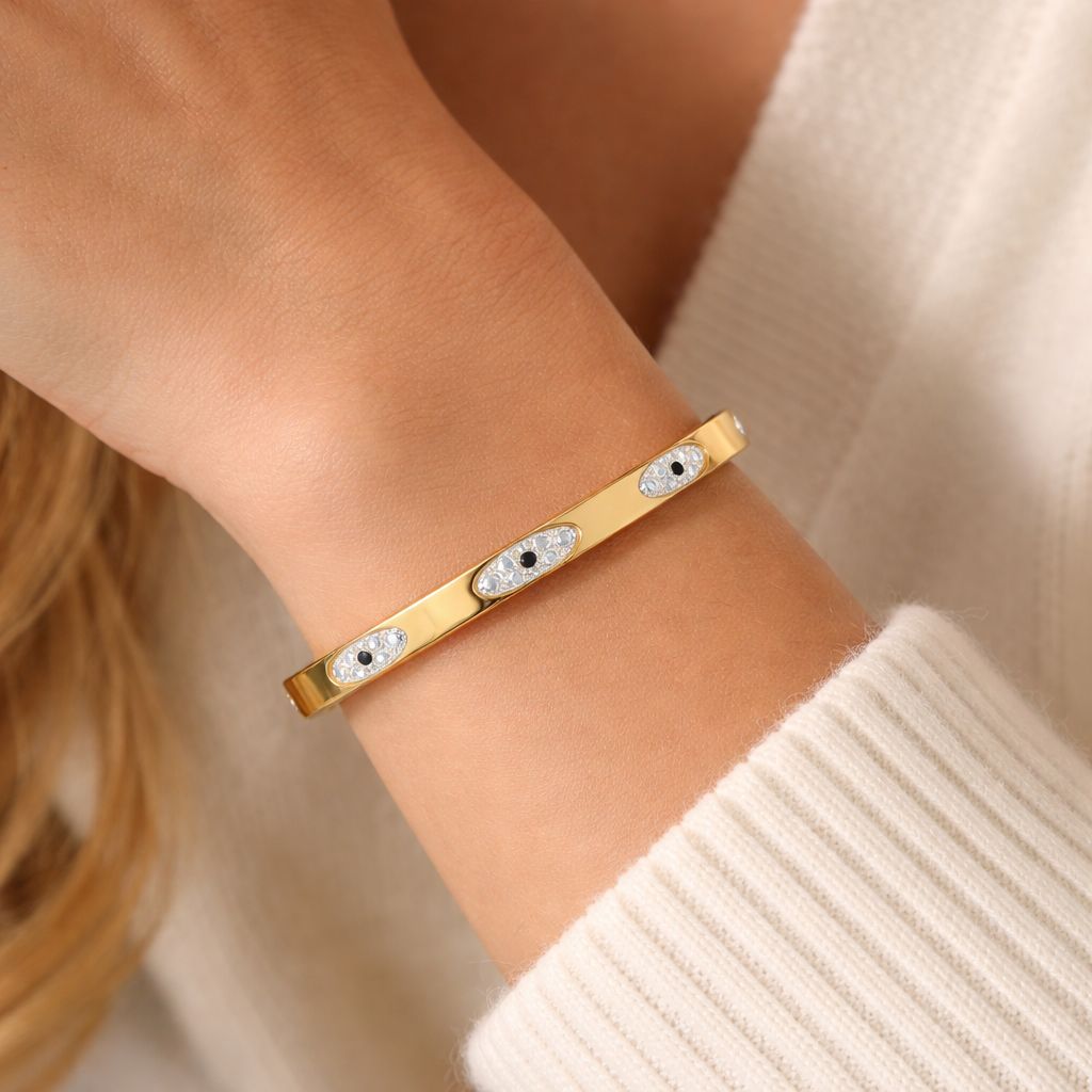 Woman wearing minimal gold bracelet styled for everyday look