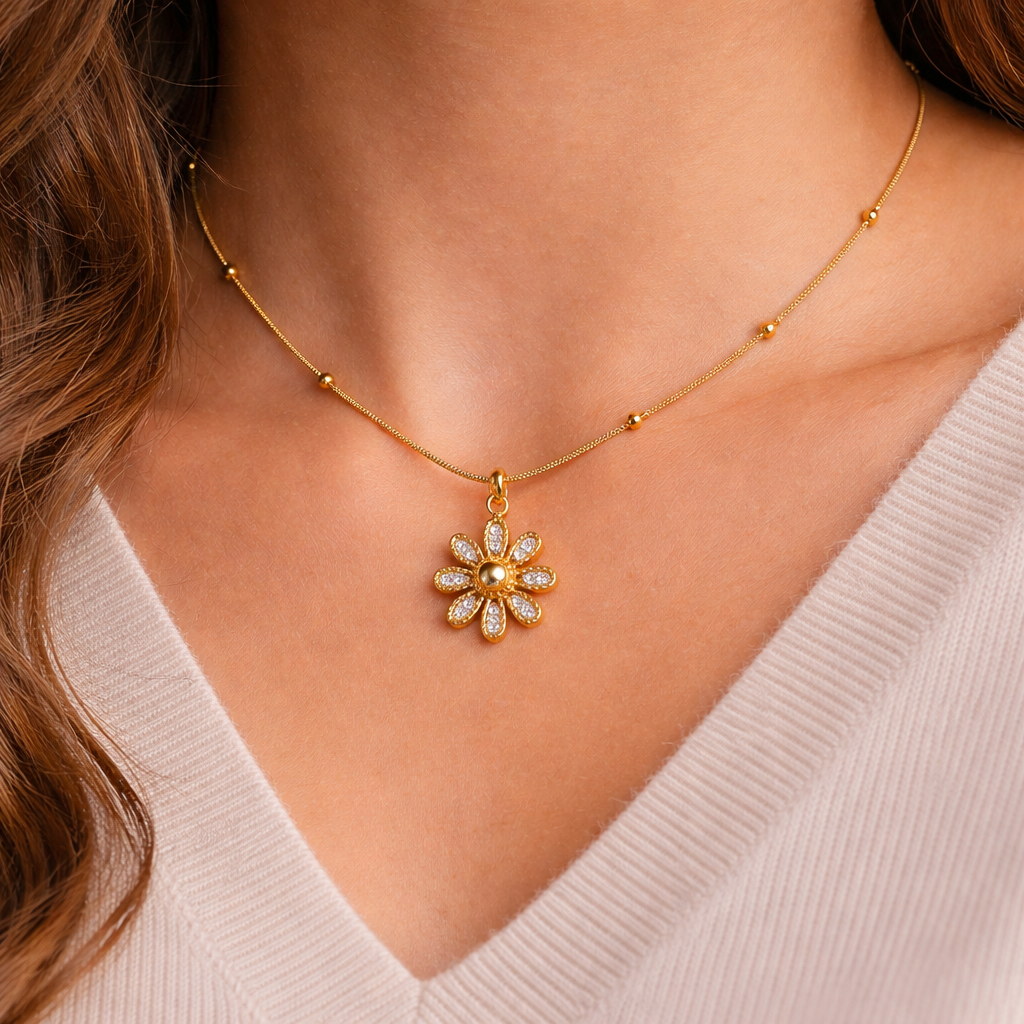 Woman wearing a minimal gold flower necklace for everyday styling
