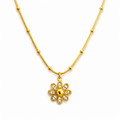 Gold flower pendant necklace with smooth finish and delicate beaded chain