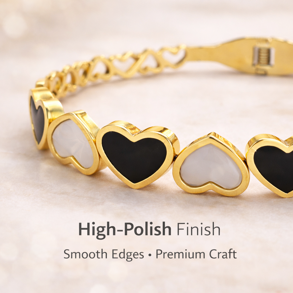 Close-up of gold heart bracelet showing polished finish and detailing