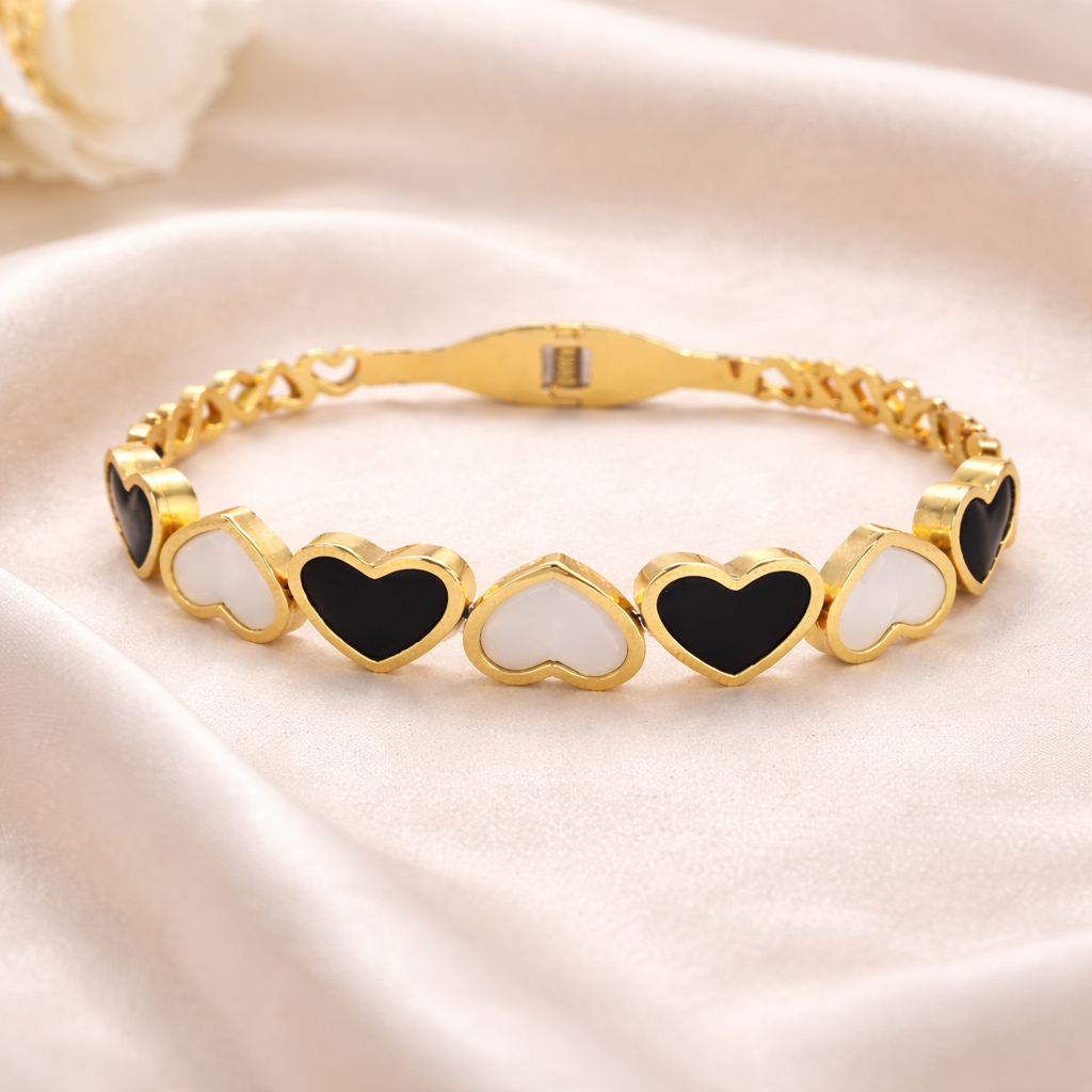 Gold heart bracelet flat lay on clean background with elegant styling