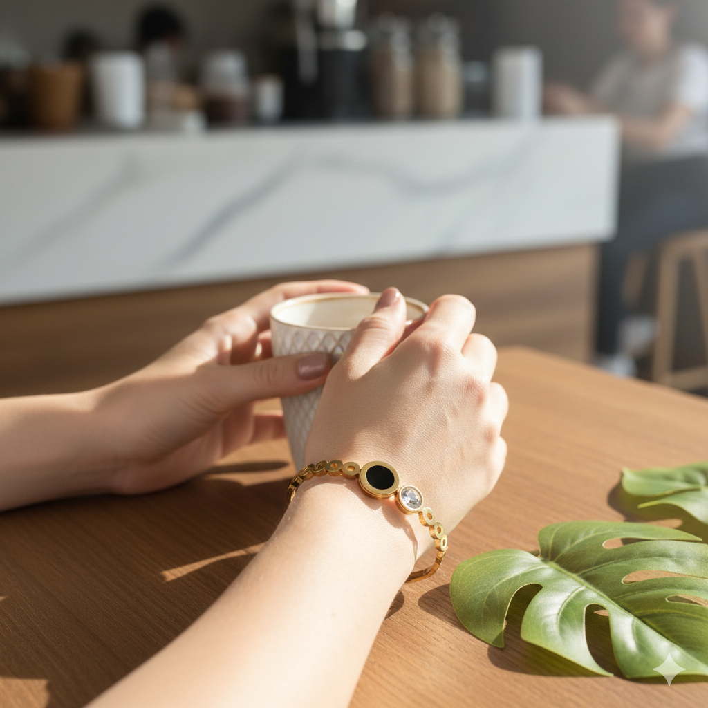 Woman wearing minimal black stone gold plated bracelet