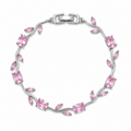 Silver tulip bracelet with pink gemstones on a white background
